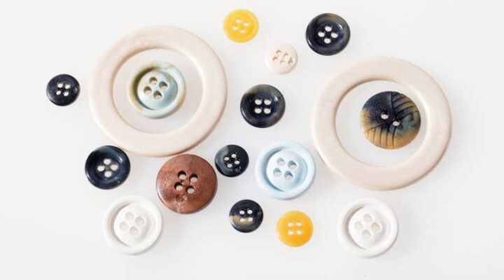 Recycled acetate buttons produced from cigarette filters, offering a sustainable material for fashion and eyewear.